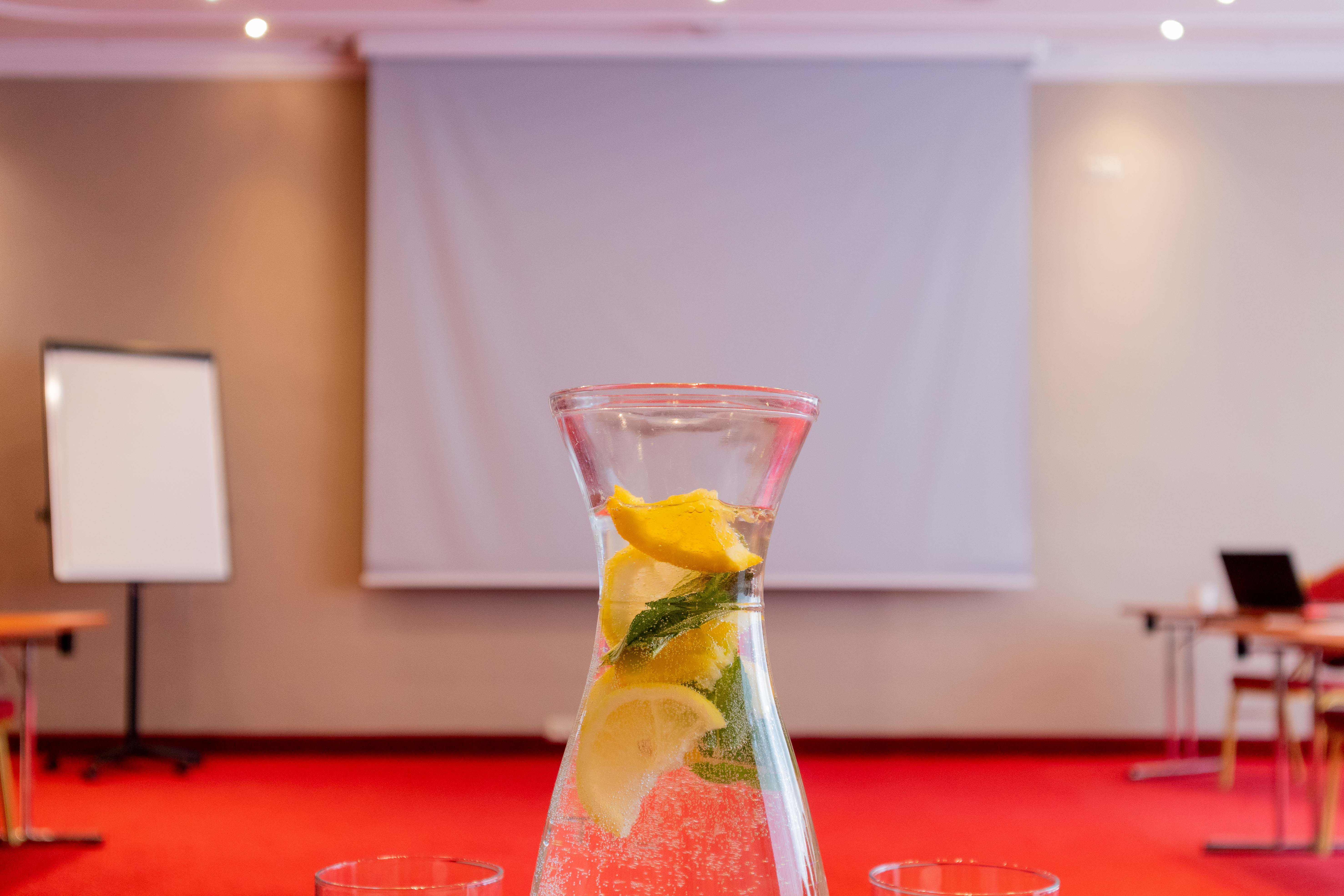 Real Estate Photography - Conference Room Red Carpet Drink Lemon